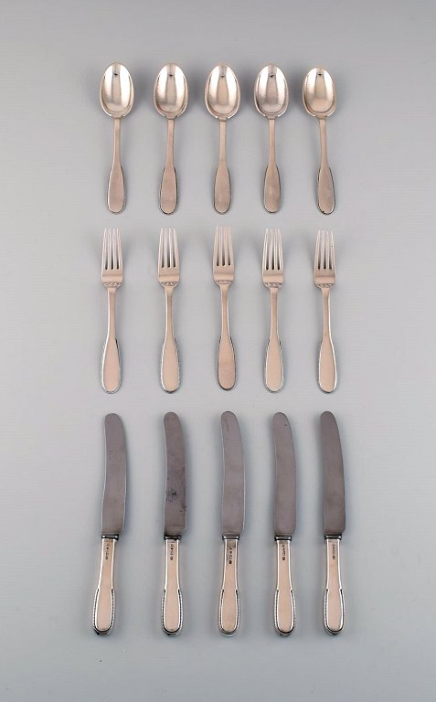Evald Nielsen number 14 lunch service in hammered silver (830) for five people. 
1920s.
