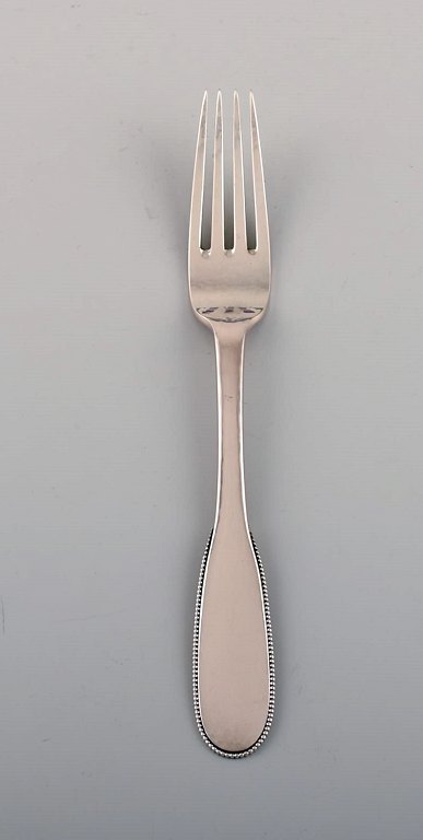 Evald Nielsen number 14 lunch fork in hammered silver (830). 1920s. 13 pcs in stock.