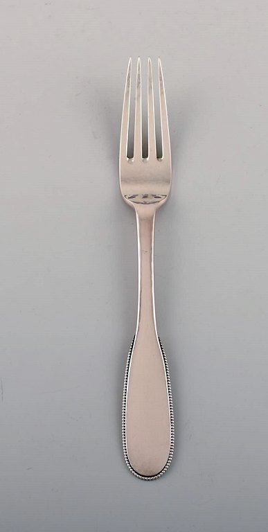 Evald Nielsen number 14 lunch fork in hammered silver (830). 1920s. 13 pcs in 
stock.
