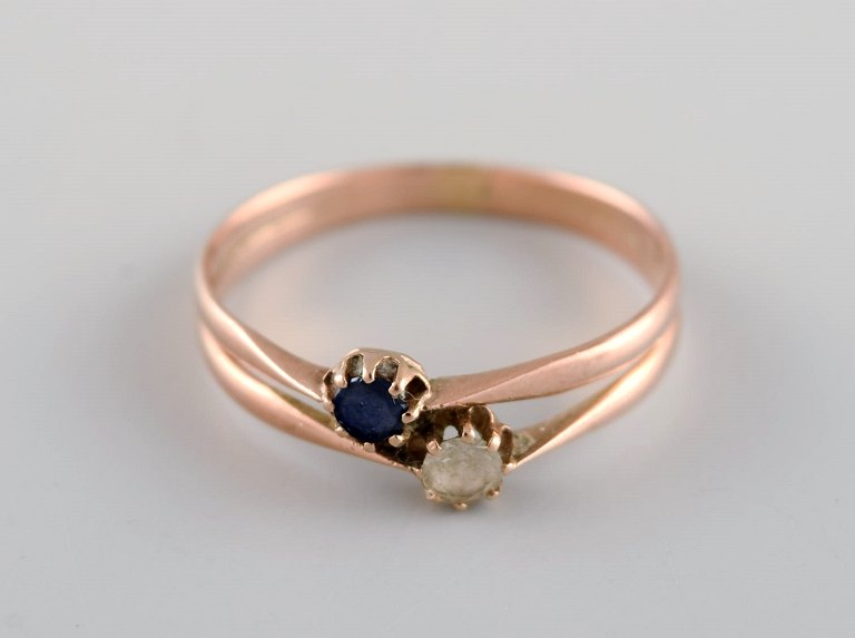 Scandinavian jeweler. Ring in 14 carat gold adorned with blue and clear 
semi-precious stones. 1930s.
