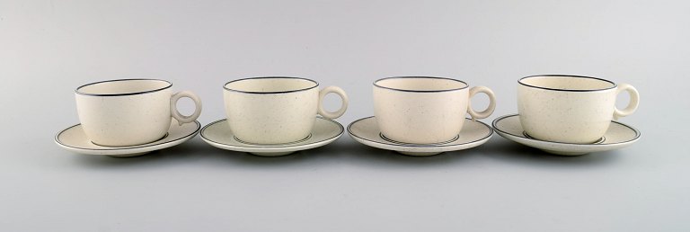 Stig Lindberg for Gustavsberg. Set of four "Birka" teacups with saucers in 
glazed stoneware. 1960s.
