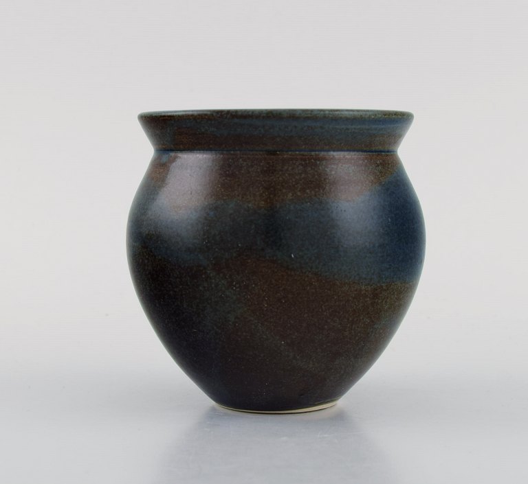 European studio ceramicist. Unique vase in glazed stoneware. Beautiful glaze in 
blue and brown shades. Late 20th century.
