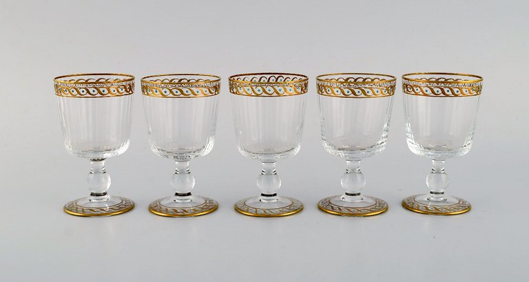 Nason & Moretti, Murano. Five liqueur glasses in mouth-blown art glass with 
hand-painted turquoise and gold decoration. 1930s.
