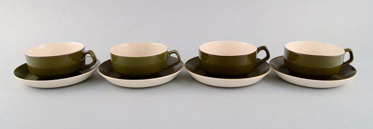 Four Aluminia Timiana teacups in glazed faience. Beautiful glaze in dark green 
shades. 1960s.
