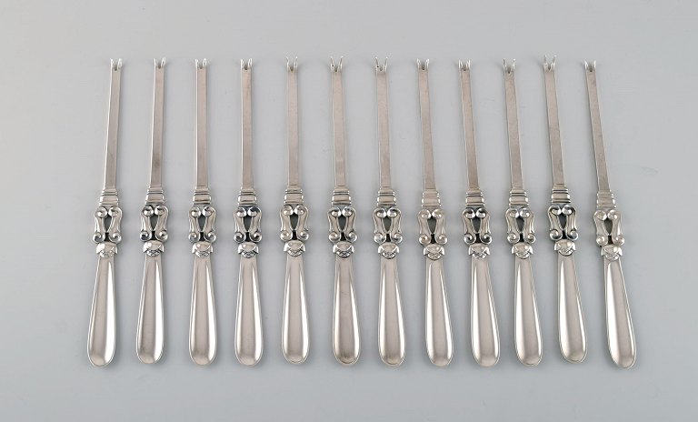 Twelve Georg Jensen Acorn lobster forks in sterling silver.
