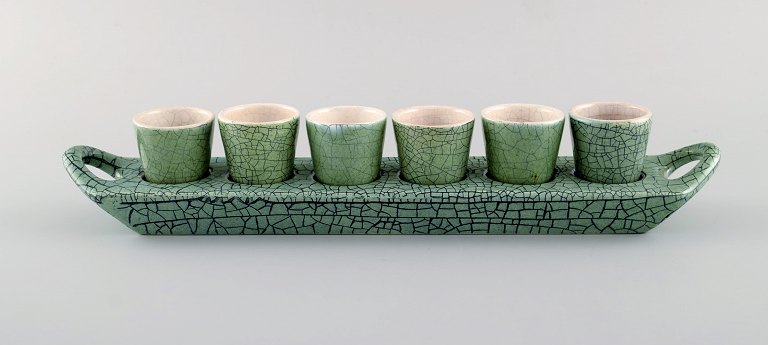 European studio ceramicist. Serving tray with beakers in glazed stoneware. 
Beautiful glaze in shades of green. 1960s.
