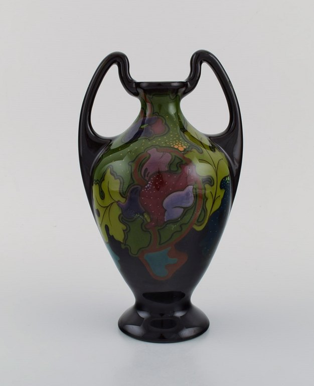 Regina, Holland. Antique art nouveau vase in glazed ceramics with hand-painted 
flowers and foliage. Approx. 1910.
