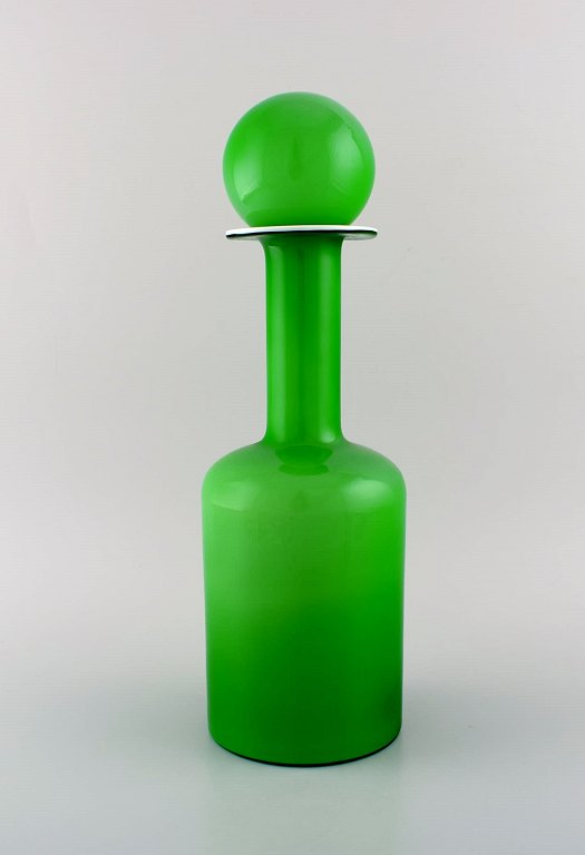 Otto Brauer for Holmegaard. Large rare vase / bottle in light green art glass 
with light green ball. 1960