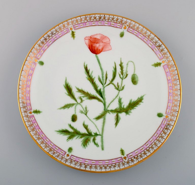 Dinner plate in Flora Danica style. Hand-painted flowers and gold decoration. 
Mid-20th century.
