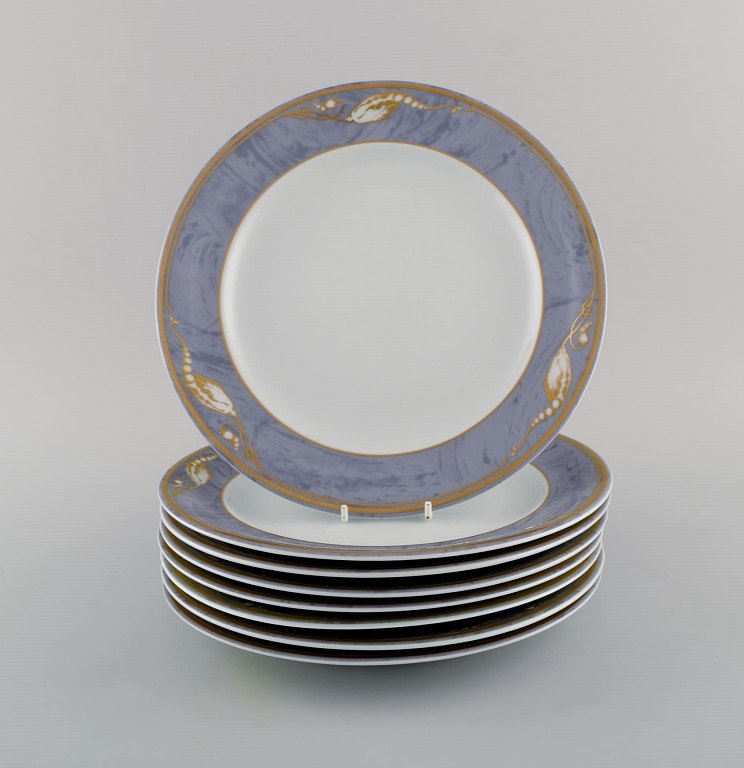 Eight Royal Copenhagen Gray Magnolia porcelain dinner plates. Late 20th century.
