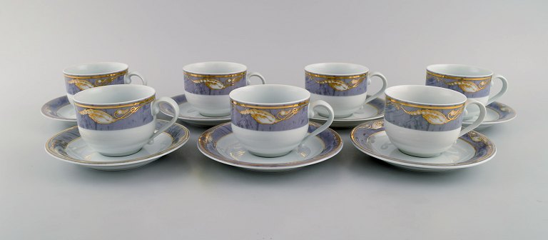 Seven Royal Copenhagen Gray Magnolia coffee cups with saucers in porcelain. Late 
20th century.

