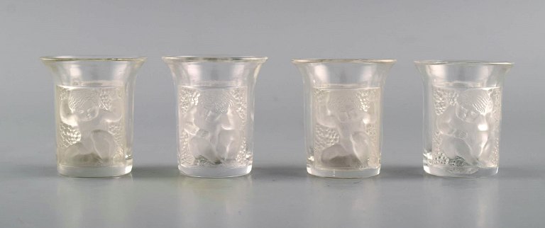 Four early René Lalique Enfants art deco shot glasses in mouth-blown crystal 
glass. 1930s.
