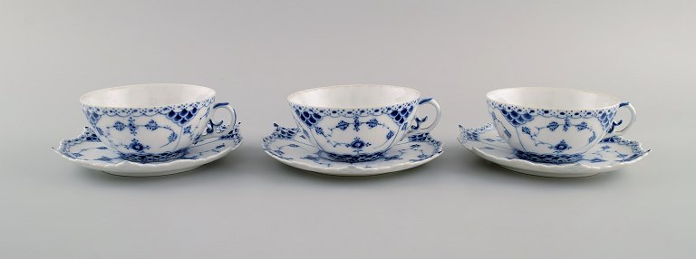 Three antique Royal Copenhagen Blue Fluted Full Lace teacups with saucers. Model 
number 1/1130. Early 20th century.
