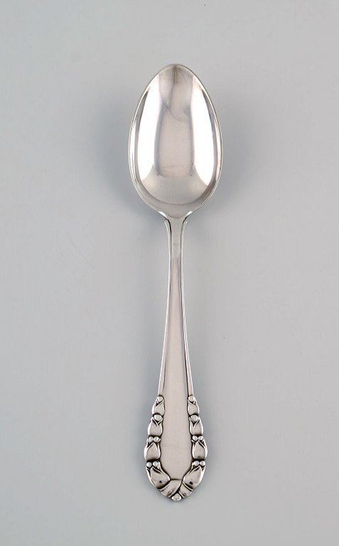 Georg Jensen Lily of the Valley tablespoon in sterling silver. Eight pieces in 
stock.
