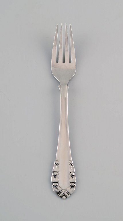 Early Georg Jensen Lily of the valley lunch fork in sterling silver. Dated 
1915-1930. Three pieces in stock.
