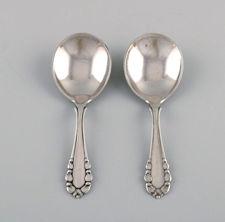 Two Georg Jensen Lily of the Valley jam spoons in sterling silver. Dated 
1933-44.
