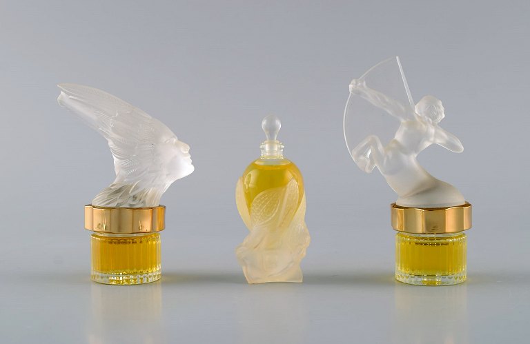 Three Lalique perfume bottles. Late 20th century.
