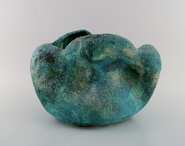 Christina Muff, Danish contemporary ceramicist (b. 1971). Sculptural unique vase 
in glazed stoneware. Beautiful green glaze with stones and minerals from 
Denmark.
