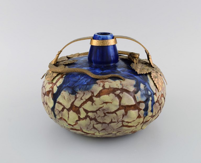 Louis Dage (1885 - 1961), French ceramist. Art nouveau vase in glazed ceramics 
with bronze mounting shaped like a snake and foliage. 1930s.
