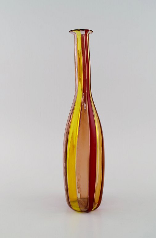 Murano bottle / vase in mouth blown art glass. Polychrome striped design in warm 
shades. 1960s.
