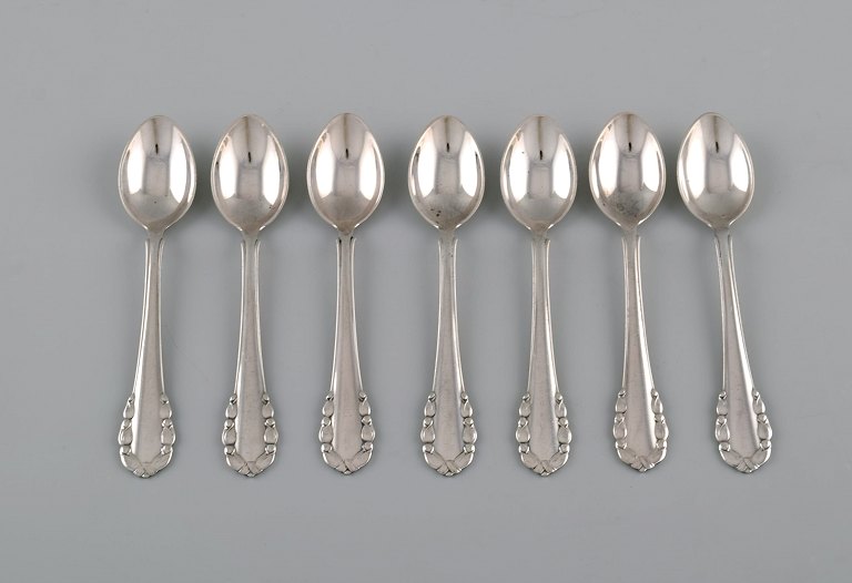 Seven Georg Jensen Lily of the Valley coffee spoons in sterling silver.
