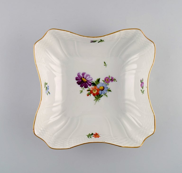 Royal Copenhagen Saxon Flower bowl in hand-painted porcelain with flowers and 
gold decoration. Model number 493/1522. Dated 1942.
