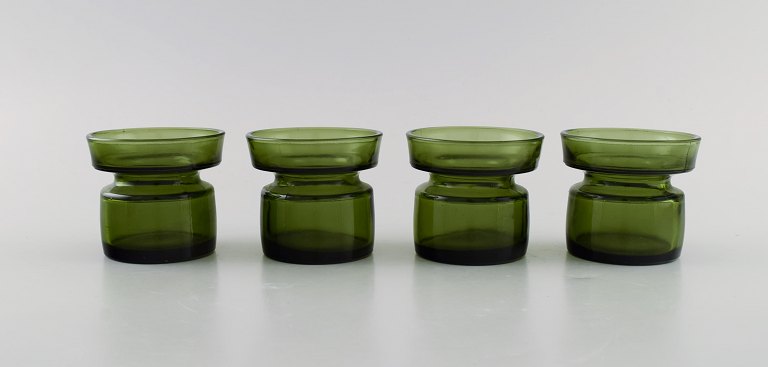 Jens Harald Quistgaard. Four "Hygge" light holders for teacandles in dark green 
art glass. Retro, 1960