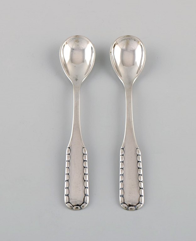Two early Georg Jensen Rope salt spoons in silver (830). Dated 1909-1914.
