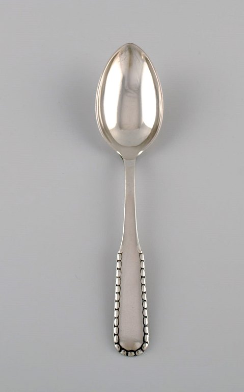 Early Georg Jensen Rope dessert spoon in silver (830). Dated 1915-1930. Three 
pieces in stock.
