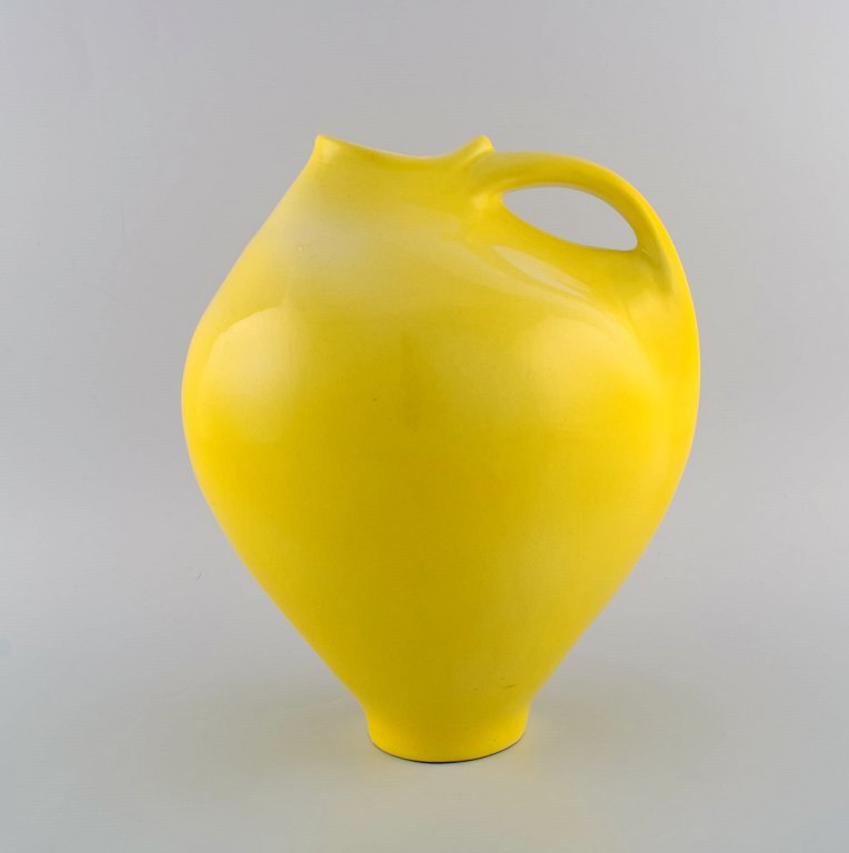 Francis Milici (b. 1952) for Vallauris. Large organically shaped unique pitcher 
in glazed ceramics. Beautiful glaze in yellow shades. Dated 1998.
