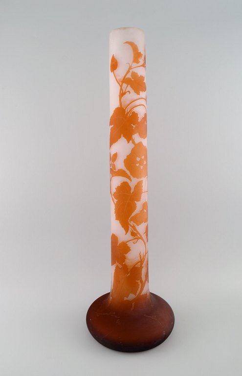 Colossal antique Emile Gallé vase in frosted and orange art glass carved in the 
form of flowers and foliage. Early 20th century. Museum quality.
