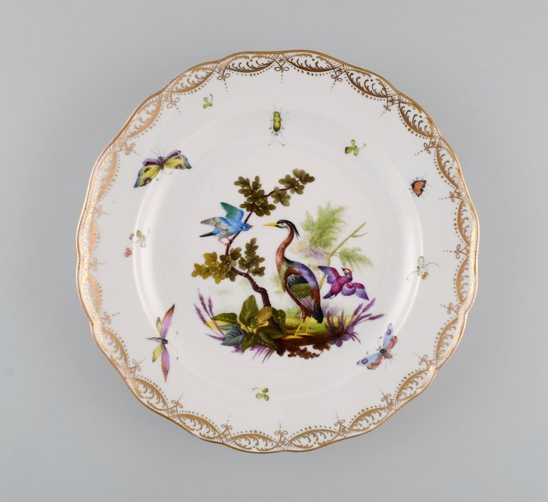 Antique and rare Meissen porcelain plate with hand-painted birds, insects and 
gold decoration. 19th century.
