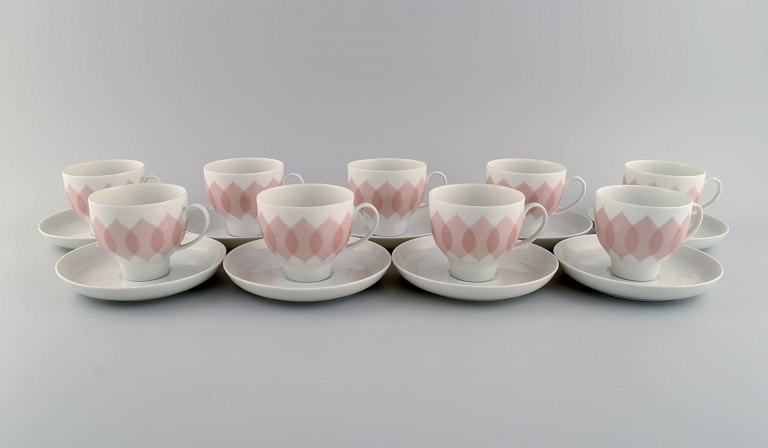 Bjørn Wiinblad for Rosenthal. Lotus porcelain service. 9 coffee cups with 
saucers decorated with pink lotus leaves. 1980s.
