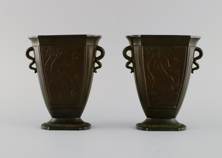 Just Andersen (1884-1943), Denmark. A pair of disko metal vases. Wavy handles. 
Woman holding dove. 1930s. Model number D28.
