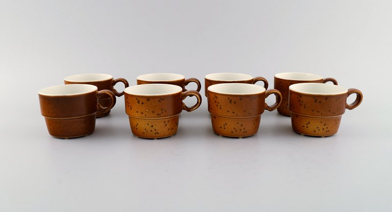 Stig Lindberg for Gustavsberg. Eight Coq coffee cups in glazed stoneware. 
Beautiful glaze in brown shades. Swedish design, 1960s.
