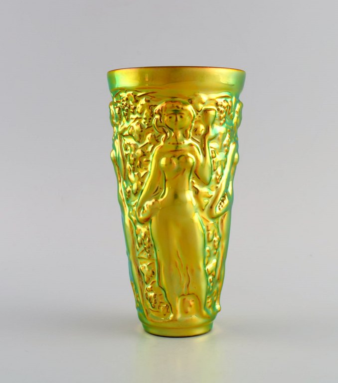 Zsolnay vase in glazed ceramics modeled with women picking grapes. Beautiful 
luster glasses. Late 20th century.
