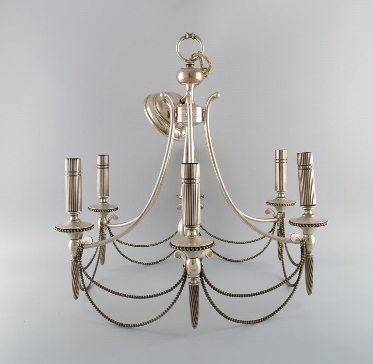 Six-armed chandelier in silver plate. Classic style. 1930