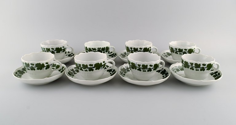 Eight Meissen Green Ivy Vine coffee cups with saucers in hand-painted porcelain. 
1940