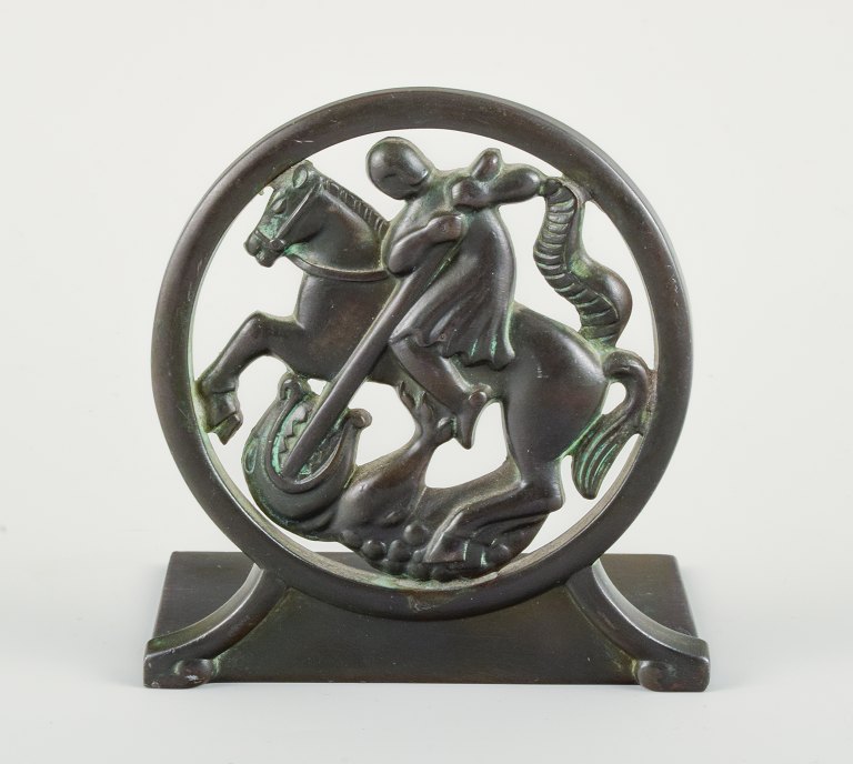 Just Andersen, Denmark. Art deco bookend in disco metal with Saint George and 
the dragon. The 1940s. Model number 1626.