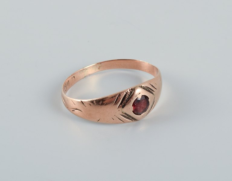 Scandinavian goldsmith, older gold ring adorned with red stone.
Stamped with the goldsmith