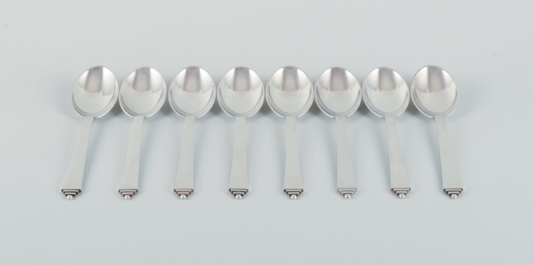 Eight Georg Jensen Pyramide dinner spoons in sterling silver.