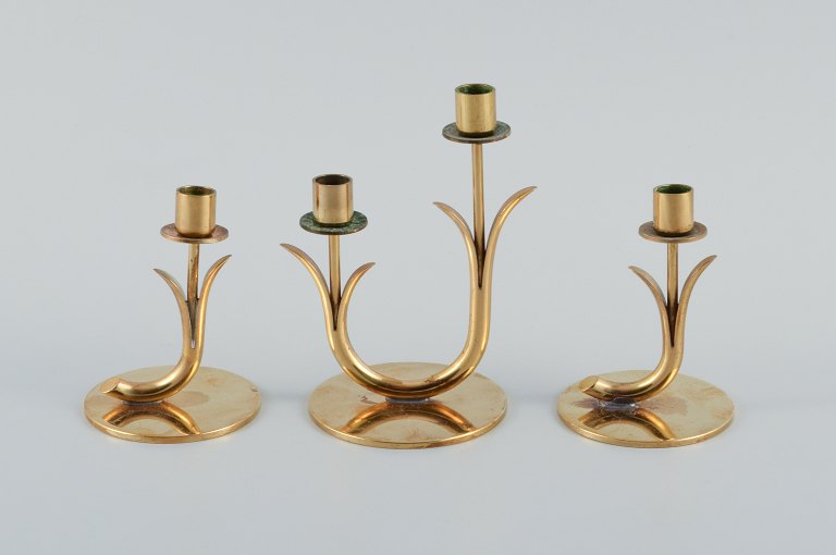 Gunnar Ander for Ystad Metall. Three brass candlesticks.
1950s.