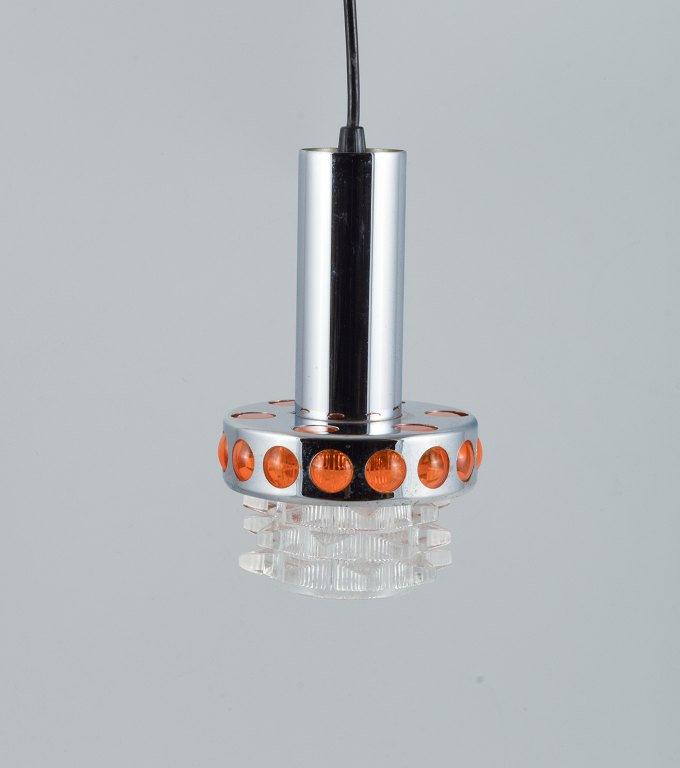 RAAK, The Netherlands. Designer lamp in chrome, orange plastic and clear glass.