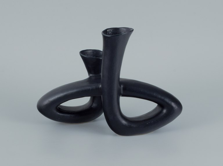 European studio ceramicist. Unique twisted vase in black glaze.