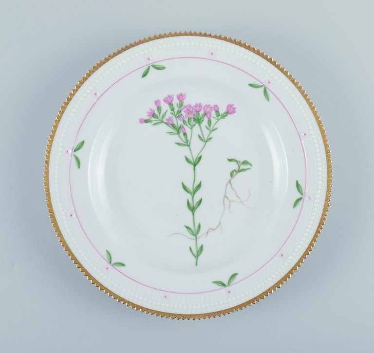 Royal Copenhagen, Flora Danica style. Dinner plate hand painted with floral 
motif and gold decoration.