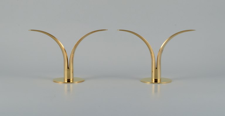 "Liljan", Ivar Ålenius Björk for Skultuna, a pair of candlesticks in patinated 
brass.