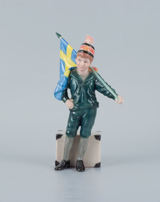 Carl Larsson Pontus for Royal Copenhagen, hand-painted porcelain figure in 
overglaze, Swedish standard-bearer boy in green clothes.