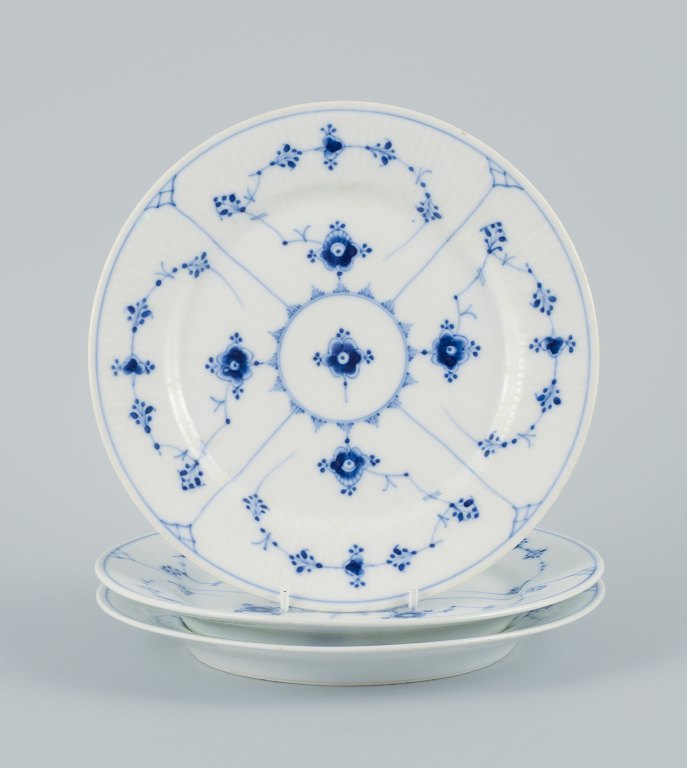 Royal Copenhagen, three Blue fluted plain lunch plates.