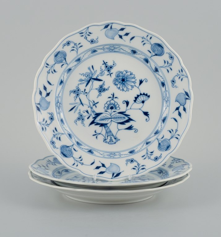 Meissen, a set of three Blue Onion dinner plates.