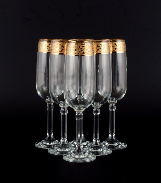 Italiensk design, seks champagneglas i klart kunstglas med guldkant.